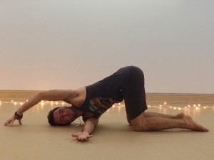 Rest the corner of the head and shoulder, taking the top arm around the back or overhead