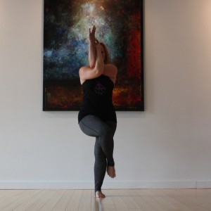 Place a gentle bend in the left leg and cross the right leg all the way over. Engage the core and inner thighs to hold the position. Relax the shoulders.